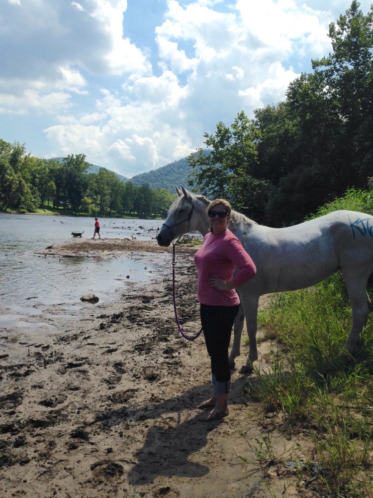 A walk to the New River after the ride with both horses
